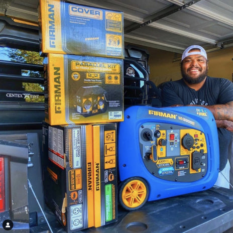 A man shows off his FIRMAN Accessories and Inverter Generator collection.