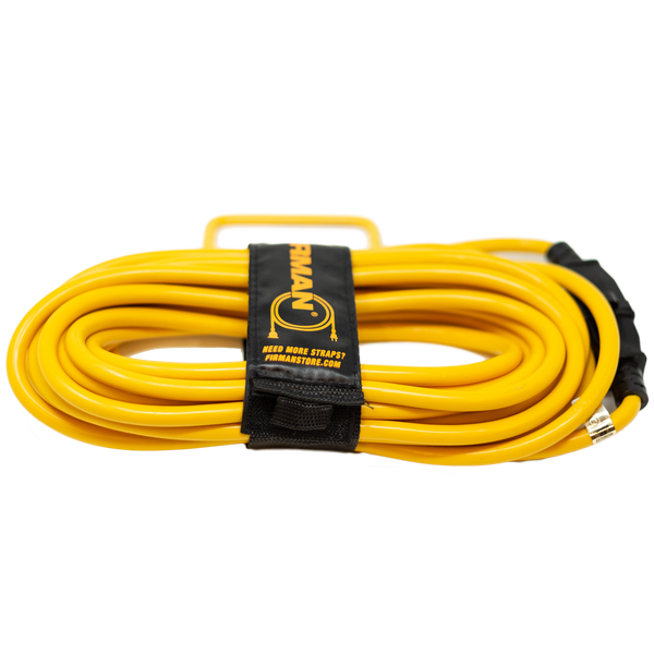 A coiled yellow FIRMAN Power Equipment 25ft Heavy Duty 5-15P to 5-15R Generator Utility Power Cord with black connectors, secured by a black storage strap.