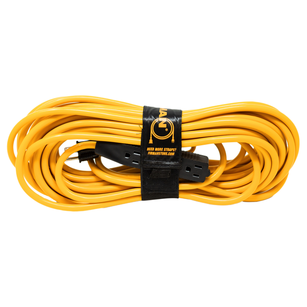 Coiled yellow FIRMAN Power Equipment 50' Medium Duty 5-15P to (3) 5-15R Generator Utility Power Cord secured with a black storage strap featuring a logo, isolated on a white background.