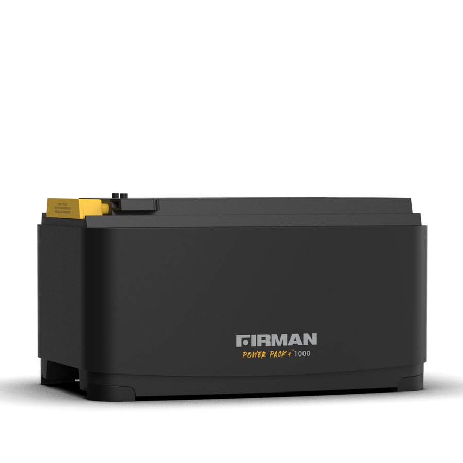 A portable FIRMAN Power Pack +1000 generator, black in color, with a yellow handle visible on top.
