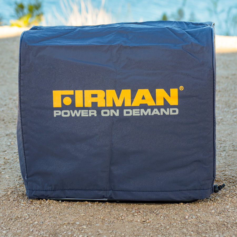 A blue Small Size Portable Generator Weatherproof Cover by FIRMAN Power Equipment, with a yellow "FIRMAN POWER ON DEMAND" logo, rests on gravel outdoors, highlighting its protective design for small generators.