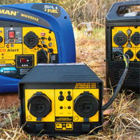 Three FIRMAN Power Equipment 50A Portable Generator Parallel Kits connect RV-ready inverter generators outdoors on dry grass, with power cables linking the units.