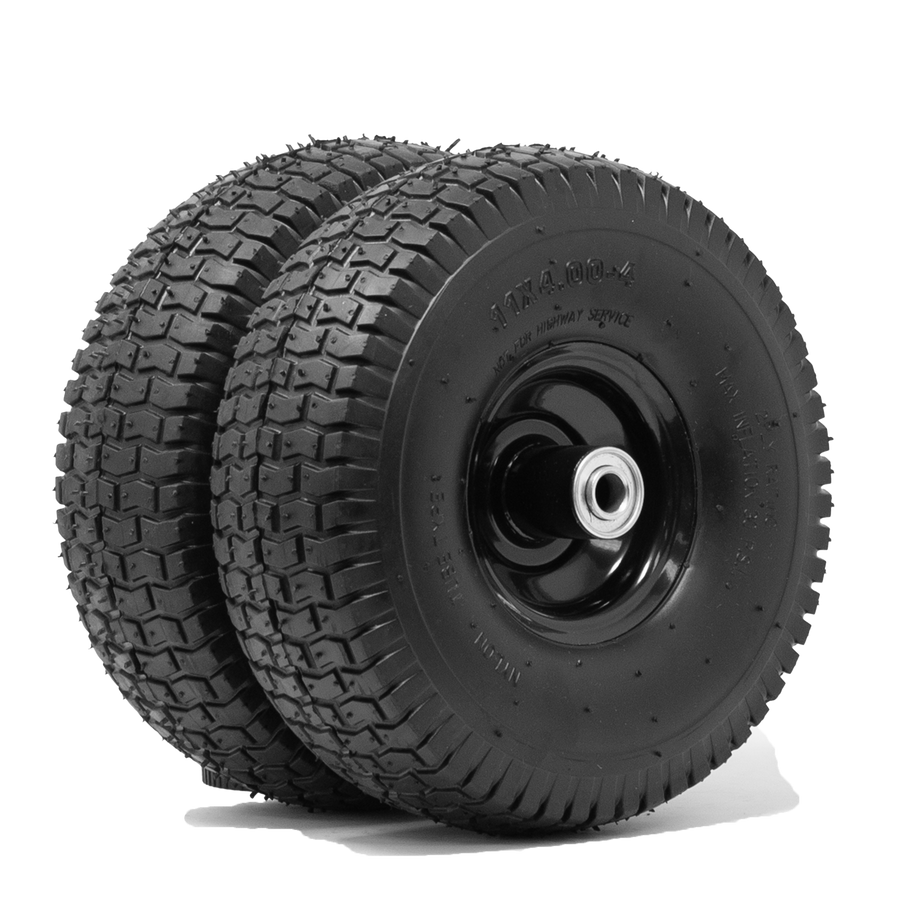 Two stacked black all-terrain go-kart tires with visible treads, mounted on dark metal rims, isolated on a white background from FIRMAN Power Equipment's 11' Wheel Kit and Handle.