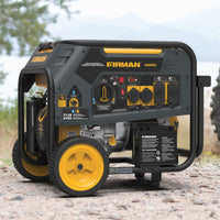 The FIRMAN Power Equipment Dual Fuel Portable Generator 5700W Electric Start 120/240V, in green and yellow, offers reliable backup power on gravel, with multiple outlets and labeled controls shown against a blurred backdrop of trees and a lake, highlighting its suitability for versatile outdoor use.