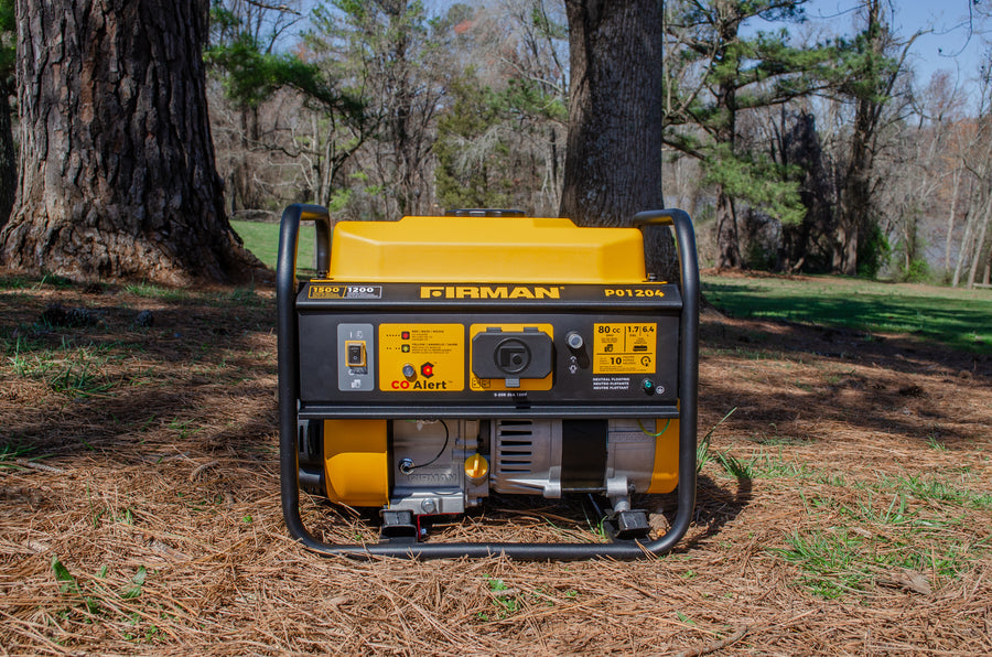 A yellow FIRMAN Power Equipment Gas Portable Generator 1500W Recoil Start with CO alert on a bed of pine needles in a forest setting with trees and grass in the background.