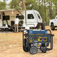 A FIRMAN Power Equipment Tri Fuel Portable Generator 7850/6300W Electric Start Gas CO Alert sits on the ground in front of an RV at a campsite, while a person stands by a table under the RV awning.