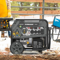 A FIRMAN Power Equipment Tri Fuel Portable Generator 9400W Electric Start 120/240V with CO Alert sits on snowy ground outdoors, with a person and other equipment seen in the background.
