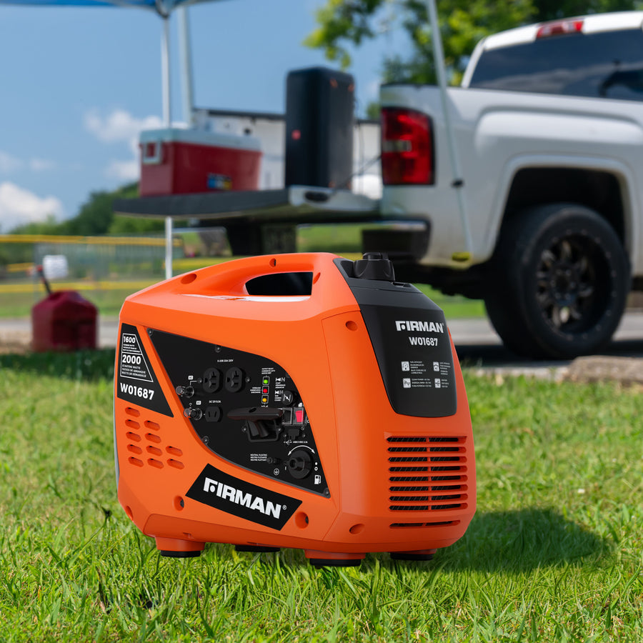 A FIRMAN Power Equipment Gas Inverter Portable Generator 2000/1600W Recoil Start sits on grass near a white pickup truck and coolers, making it an ideal camping generator for your outdoor adventures.