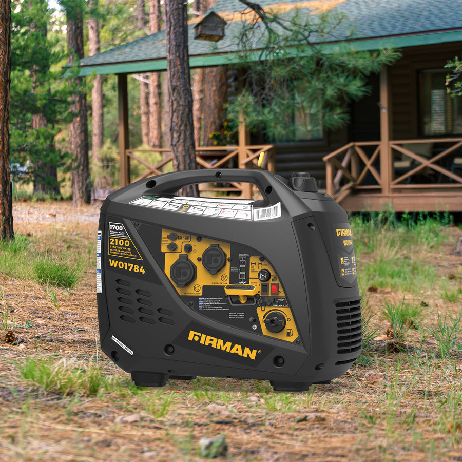 A FIRMAN Power Equipment Inverter Portable Generator 2100W Recoil Start sits on grass near a cabin in a wooded area.