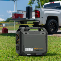 A FIRMAN Power Equipment Inverter Gas Portable Generator 2500W Recoil Start with CO ALERT sits on grass near a white pickup, cooler, and outdoor gear at a campsite.