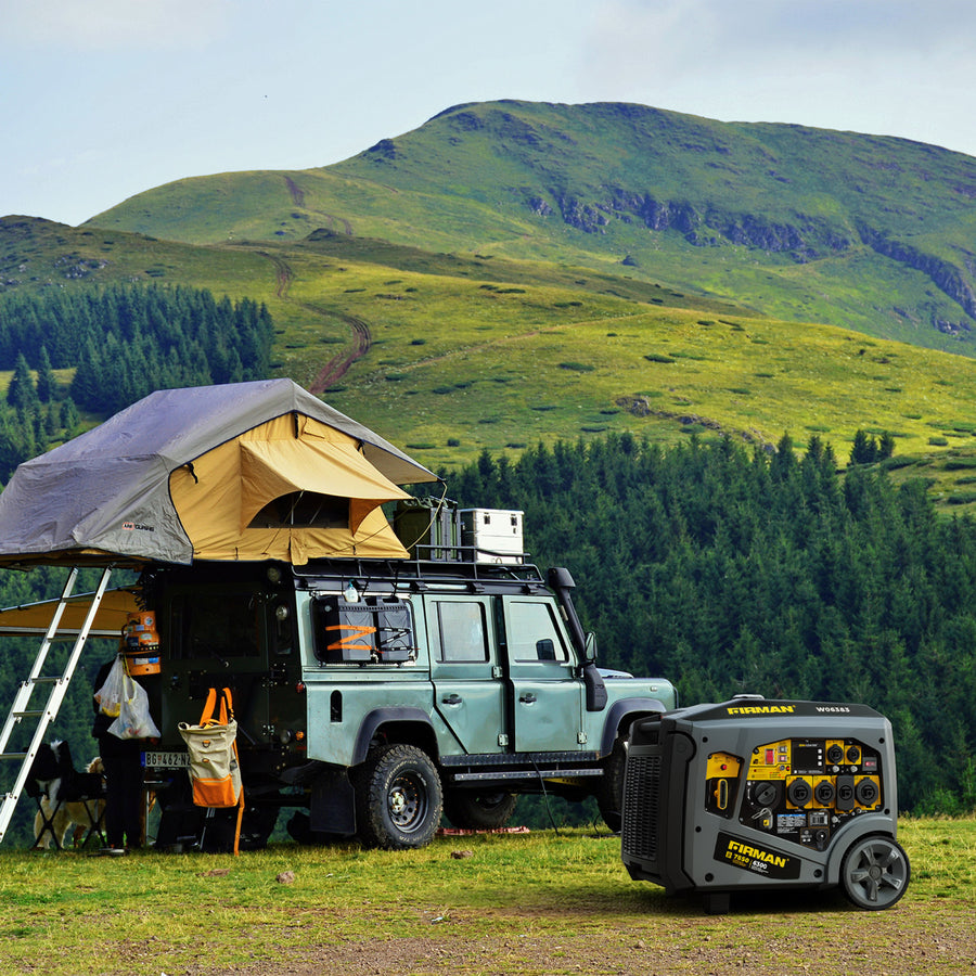 A rugged off-road vehicle with a rooftop tent is parked on the grass near hills, alongside a FIRMAN Power Equipment Gas Inverter Portable Generator 7850/6300 Watt with remote start and CO Alert.