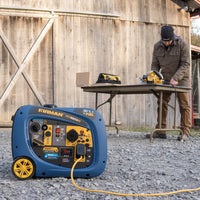 A FIRMAN Power Equipment Dual Fuel Inverter Portable Generator 3200W Electric Start is running on gravel, powering tools on a table as someone works outside a wooden building.