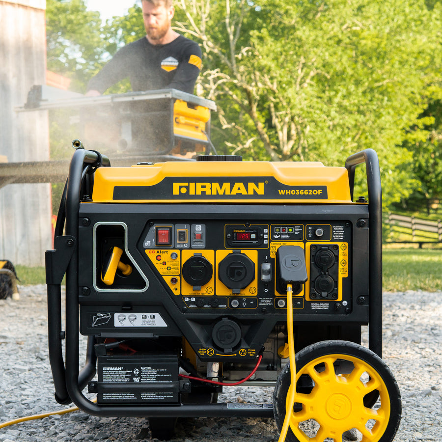 A FIRMAN Power Equipment Dual Fuel Open Frame Inverter 4500W Electric Start with CO Alert is running outdoors on gravel, while a person uses power tools in the background.