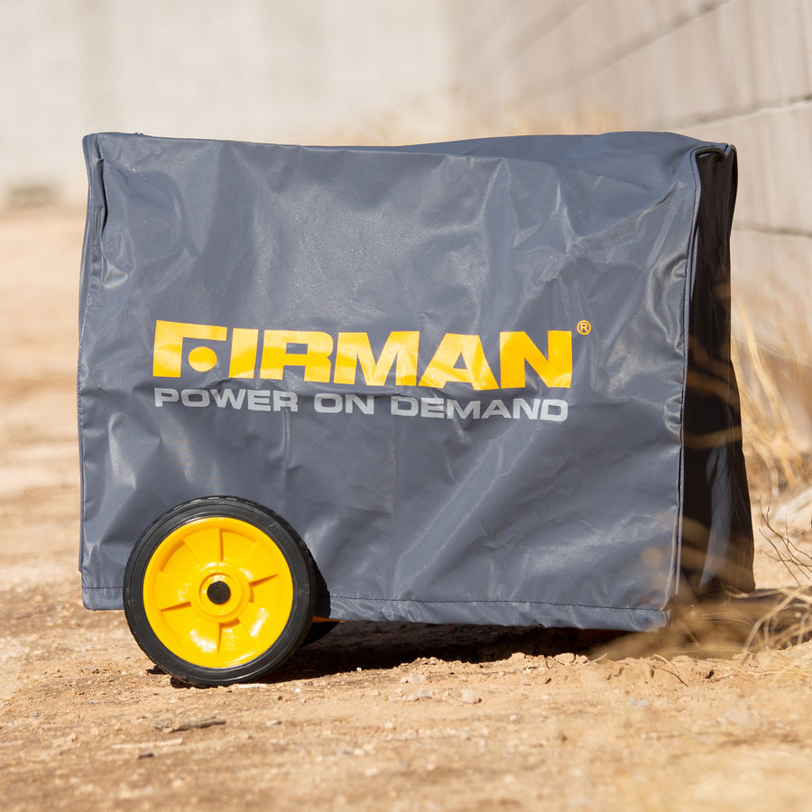 A FIRMAN Power Equipment Medium Size Portable Generator And Inverter Cover, covered with a protective all-weather black and yellow branded cover, parked on a concrete surface next to a wall.