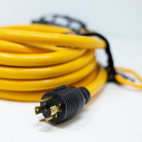 A coiled yellow FIRMAN Power Equipment extension cord, essential for workspace organization, with a black plug in focus against a white background.