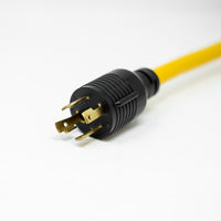Close-up of a yellow electrical power cord with a black 5-20R three-prong plug on a white background. Product Name: Heavy Duty L14-30P to (4) 5-20R Short Power Cord With Attachment Clips Brand Name: FIRMAN Power Equipment.