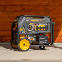 A FIRMAN Power Equipment Dual Fuel Portable Generator 7500W Electric Start 120/240V with yellow wheels parked against a wooden wall, featuring various outlets and control knobs.