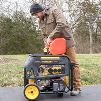 A man refueling a FIRMAN Power Equipment Dual Fuel Portable Generator 9400W Electric Start 120/240V with CO Alert outdoors on a paved path with trees in the background.
