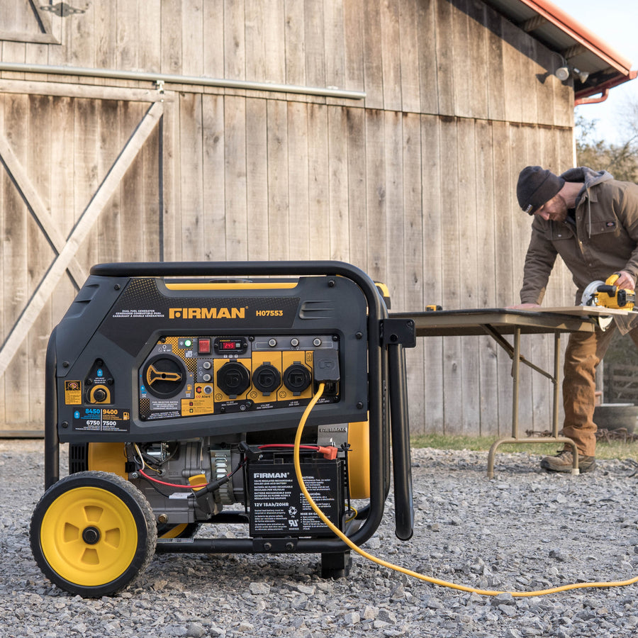 A man operates a circular saw at a wooden table outdoors, near a large portable FIRMAN Power Equipment Dual Fuel Portable Generator 9400W Electric Start 120/240V with CO Alert.