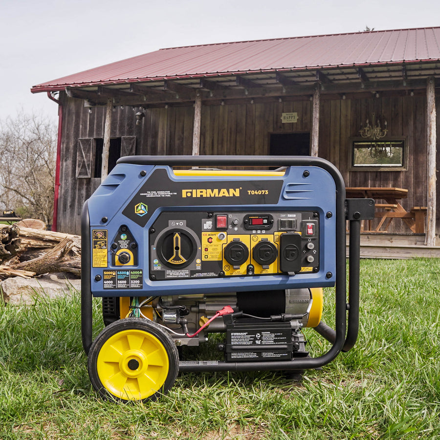 A Tri Fuel Portable Generator 4000W Electric Start 120/240V with CO ALERT from FIRMAN Power Equipment set in front of a rustic barn surrounded by green grass and logs.