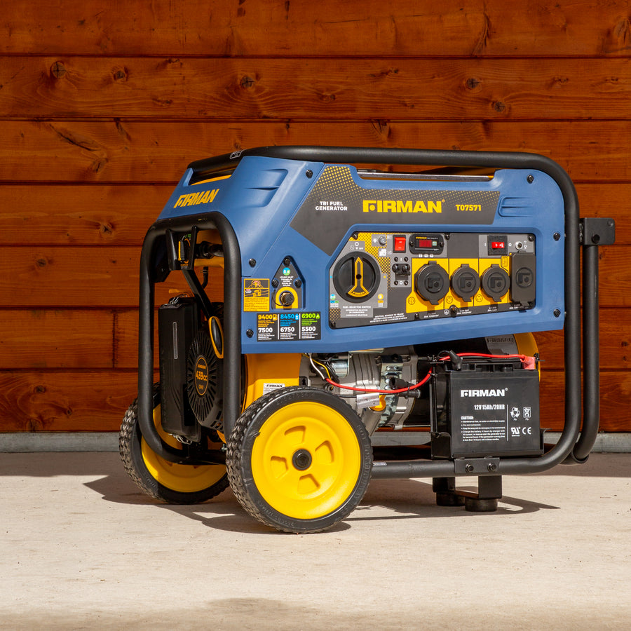 A blue and yellow FIRMAN Power Equipment Refurbished Tri Fuel Portable Generator 7500W with exposed engine and large wheels, parked against a wooden wall.