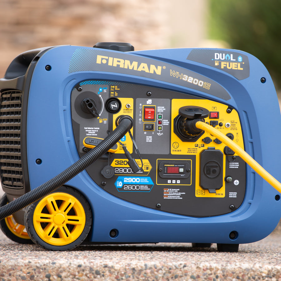 A blue and yellow FIRMAN Power Equipment WH02942 Dual Fuel Inverter Portable Generator 3200W Electric Start displayed outdoors, with a black power cord plugged in.