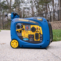A portable FIRMAN Dual Fuel Inverter Portable Generator 4125W Electric Start with CO ALERT, with yellow wheels, displayed on a concrete path with grass and trees in the background.